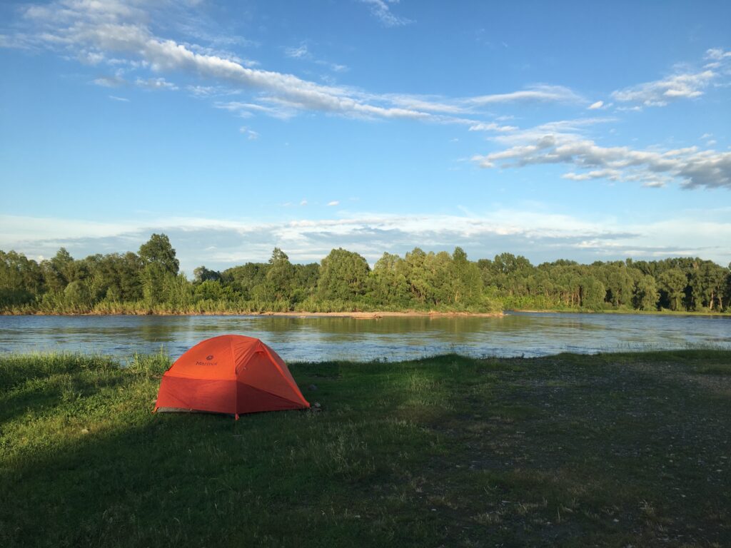 Wild camping by a river searching for freedom