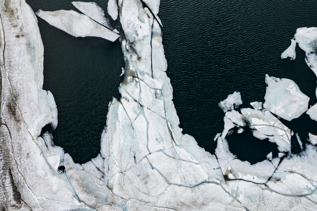 Aerial view of the ocean covered in ice