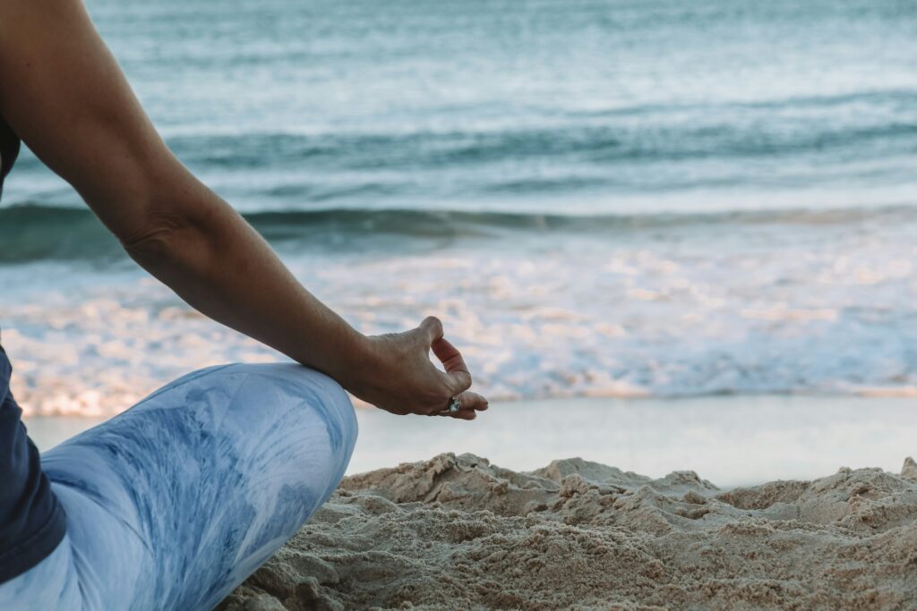 meditating and breathwork at the beach