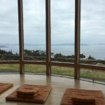 meditation center with yoga mats looking out at the ocean