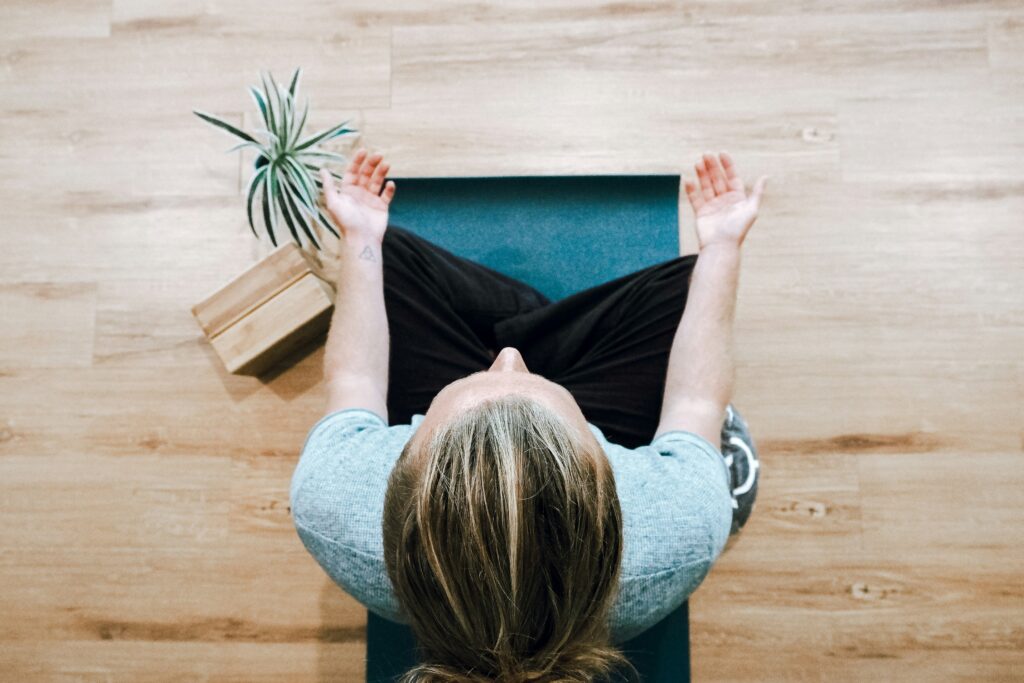 lady in locus pose practicing breathwork