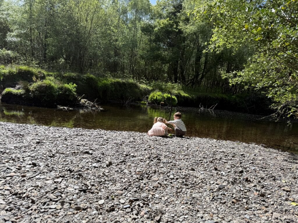 relaxing by the river with my kids to calm my nervous system